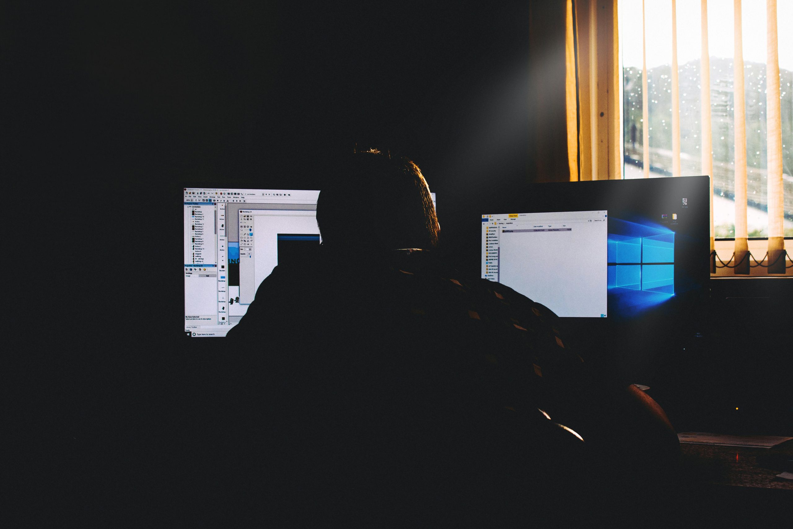 Photo Showing a Developer Working on a Website